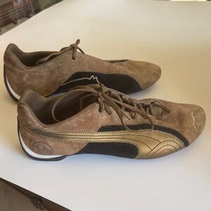 Puma women’s Brown and Gold Sneakers